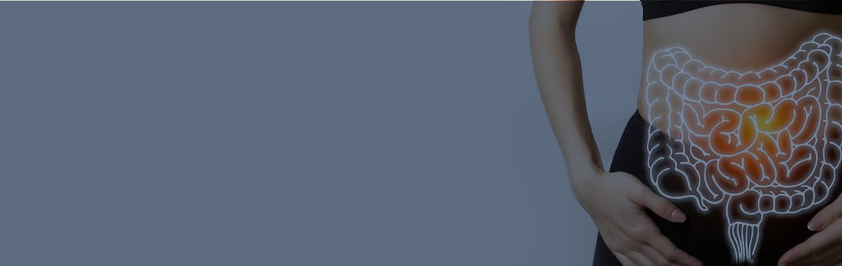 Woman holding stomach with digital digestive tract illustration, symbolizing gut health and intestinal wellness.